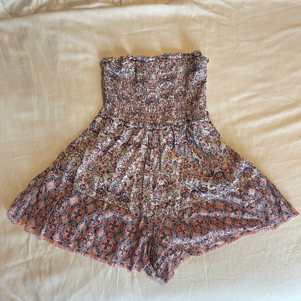 Small Romper with beautiful flower print.